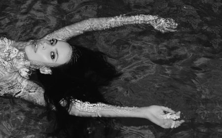 Beautiful sexy passionate woman with sensual look at the swimming pool. Banner for design header,...