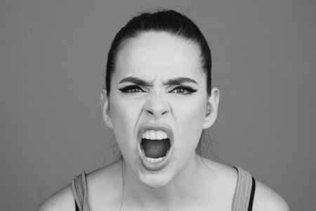 Screaming, hate, rage. Pensive woman feeling furious mad and crazy stress. Sad and angry face....