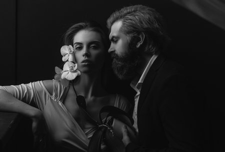 Beauty couple of young lovers. Sexy couple in shadow. Passionate sexy moments. Romantic couple in love feeling romance.の写真素材