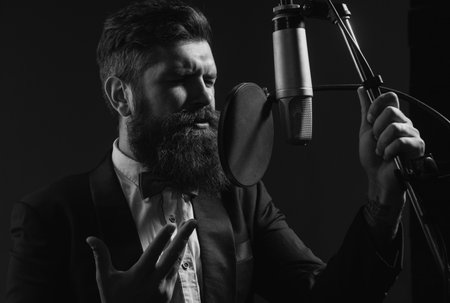 Music festival. Karaoke singer. Man singing with music microphone.の写真素材