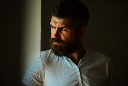 Shadow male face. Close up portrait of guy with serious profile face. Handsome man with serious...