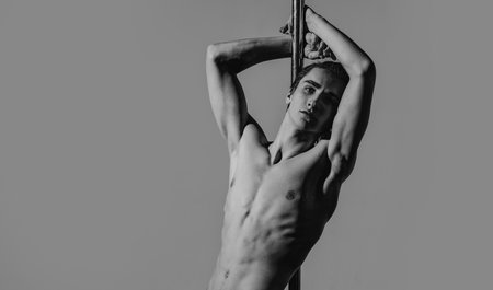 Sexy man with muscular body and bare torso. Muscular shirtless man, attractive guy. Athletic man, fitness model. Sexy torso. Male flexing his muscles. Sport workout bodybuilding.の写真素材