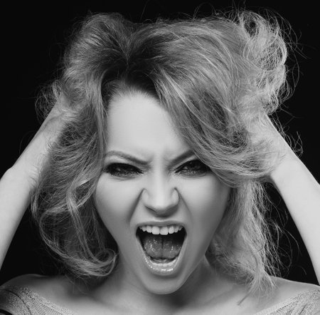 Shouting mouth, screaming face. Emotional angry woman, upset girl. Screaming, hate, rage. Pensive woman feeling furious mad and crazy stress.の写真素材