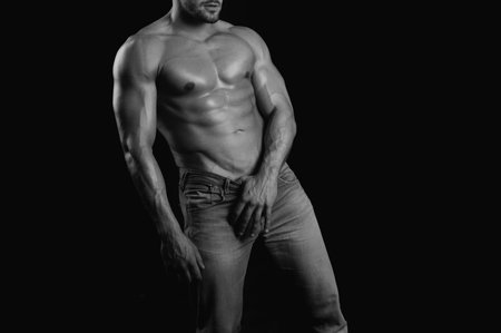 Hot boy. Muscular mans torso. Male flexing his muscles.の写真素材