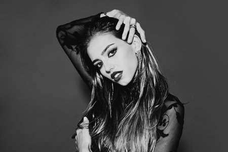 Portrait of fashion model with professional make-up and long black eyelashes. Perfect clean skin....
