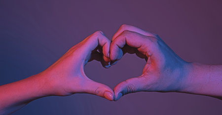Female and male hands in form of heart. Hands in shape of love heart. Heart from hands . Love,...