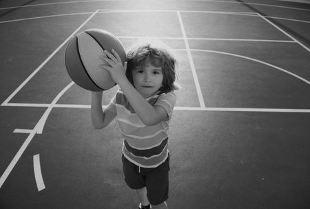 Basket ball kids player. Hobby, active lifestyle, sports activity for kids.の写真素材