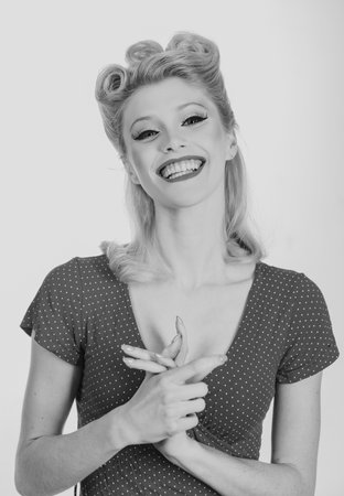 Laughing cute woman. Portrait of happy smiling girl. Cheerful young beautiful girl smiling laughing, studio isoalted background.の写真素材