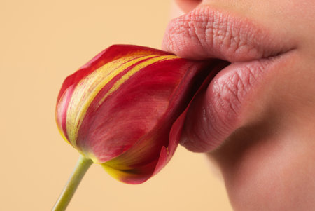 Foreplay blowjob. Sexy girl sucking and licking flower. Blowjob fellation concept. Oral sex. Girl blowjob. Blow job oral sex simulation. Blowjob and sensual oral lick. Sexy female mouth and flower.の写真素材