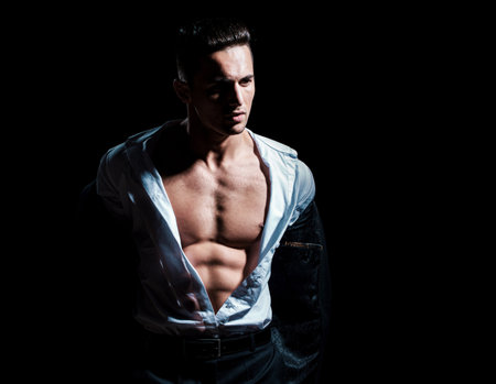 Sexy male bare torso. Man undressed shirt. Muscular guy with sexy torso. Athletic young boy showing his perfect naked body.の写真素材