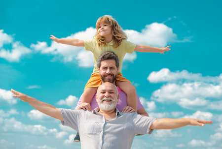 Generational famil. Father, son and grandfather happy multi genration family with raising hands or...