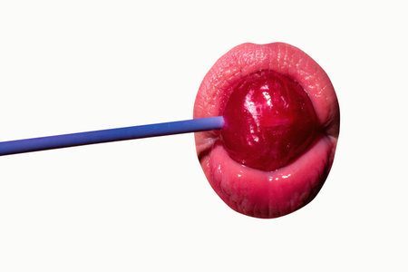 Licking candy. Lollipop model. Woman lips sucking a candy. Glamor sexy model with red lips eat...