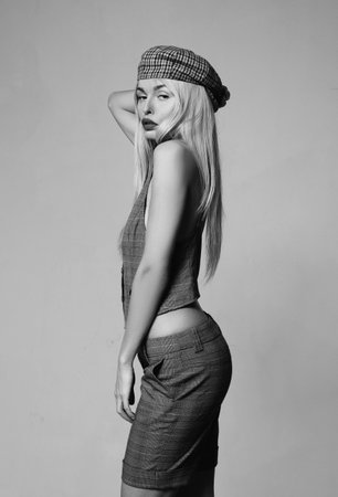 red lips. retro woman in checkered beret. Sexy girl. Beauty and fashion. trendy look. Sensual woman. makeup and hair style. Sexy woman with fashion makeup. silicone lips. sexy fashion modelの写真素材