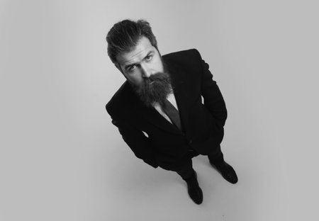 Funny handsome businessman in suit, wide angle.
