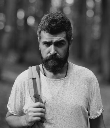 Hiker man with backpack hiking in forest.の写真素材