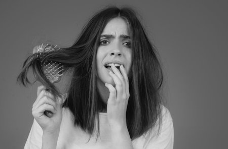 Hair for hair loss problem, woman show her hair tangled damaged hair.の写真素材