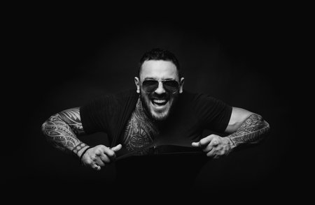 Portrait of stylish handsome excited man. Fashion guy. Masculine confident guy.の写真素材