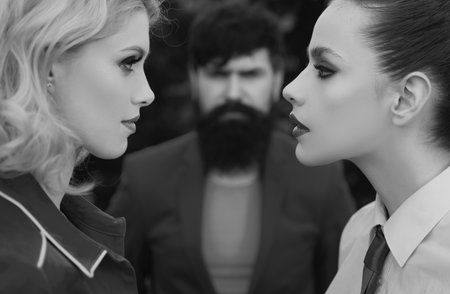 Love the triangle of two woman. Infidelity and jealousy concept.の写真素材