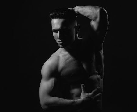 Muscular sexy man with fit naked torso.の写真素材