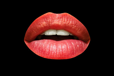 Red sexy female lips isolated on a black background, beautiful lips, beauty red lipstick.の写真素材