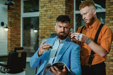 Barber shaving a bearded man in a barber shop. Hair salon and barber vintage. Senior man visiting hairstylist in barbershop. Barber shop vintage.の写真素材