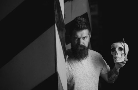 Advertising and barber shop concept. Razor sharp. He is doing styling with the shaver. Professional hairstylist in barbershop interior. Hair Stylist and Barber.の写真素材