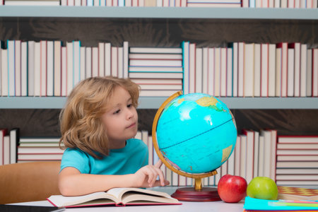 Back to school. Funny little boy from elementary school with book. Education.の写真素材