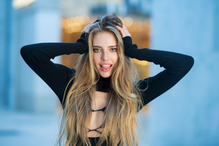 Fashion blonde woman on street. Outdoor portrait of young elegant fashion model, urban style. Pretty girl.の写真素材