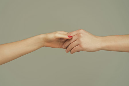 Helping hand. Holding hand, close up. Giving a help hand. Rescue, helping gesture or hands. Salvation relations. Help gesture or hands. Support hand.の写真素材
