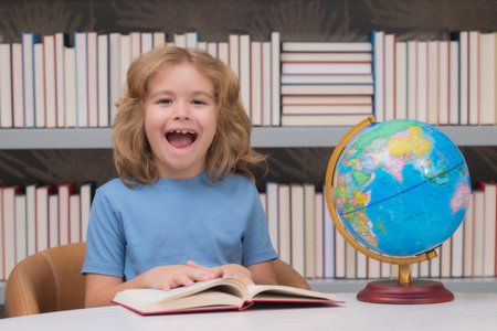 School child 7-8 years old with book go back to school. Little student.の写真素材