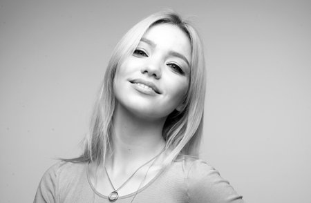 Portrait of happy young woman. Beautiful happy smiling woman face for perfume cosmetics advertising.の写真素材