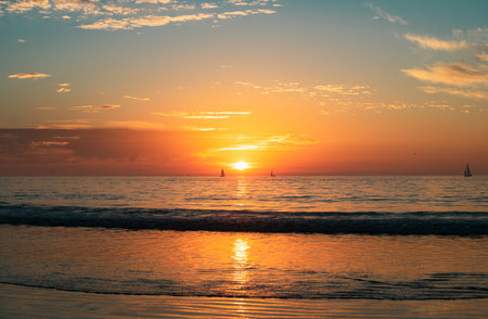 Ocean sunset on sky background with colorful clouds. Calm sea with sunrise sky.