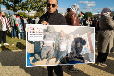 Washington DC, USA - October 21, 2023: Pro-Palestine, anti-Israel protesters. Israel and Hamas in the Gaza Strip. War between Israel and Palestine. Protest Signs at Palestine Protest in Washington DC.のeditorial素材