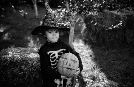 Little boy at a Halloween party. Child care. Happy child in nature. Happy day.の写真素材