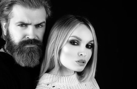 Portrait of beautiful sexy model woman and man couple looking in camera. Passionate love and beauty concept.の写真素材