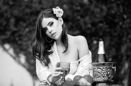 Sexy summer tropical fruit. Young beautiful model on vacation holiday outdoor. Summer mood. Dreaming italian or hispanic girl.の写真素材