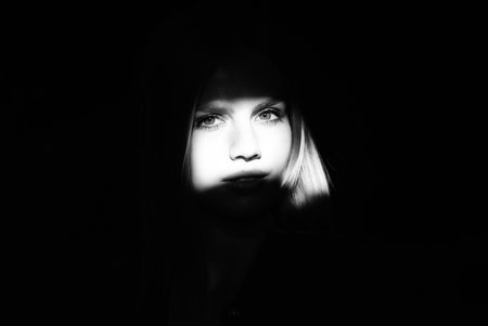 Glamor woman portrait, dark beautiful face, female isolated on black background, stylish sexy look,...
