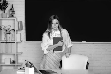 Student preparing exam and learning lessons in school classroom.の写真素材