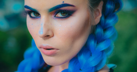 Pigtails. Beautiful Young Woman with Clean Fresh Skin. Girl beauty face closeup.の写真素材