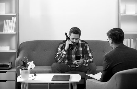 Man with psychologist theraphy social problems concept alcohol addiction. Middle aged man crisis.の写真素材