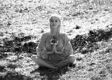 Young woman relaxing in sakura the flowers.の写真素材