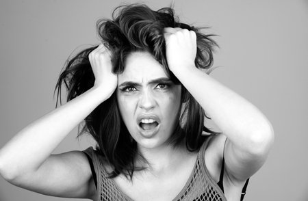 Angry woman. Shouting mouth, screaming face. Pensive woman feeling furious mad and crazy stress.