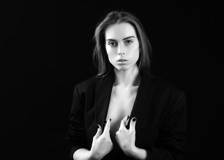Beauty woman face portrait in studio. Beautiful girl with clean skin, natural make-up.の写真素材
