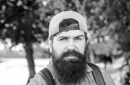 Bearded man outdoor. Spring park. Close up men portrait.の写真素材
