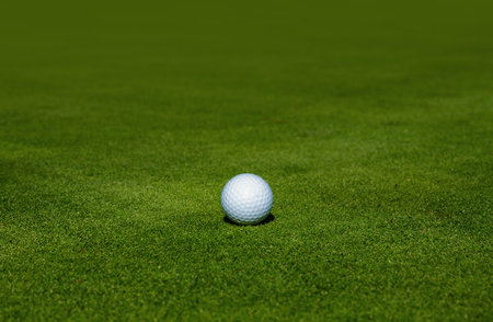 Sport golf background with copy space. Golf ball on tee ready to be shot. Golf club background.の写真素材
