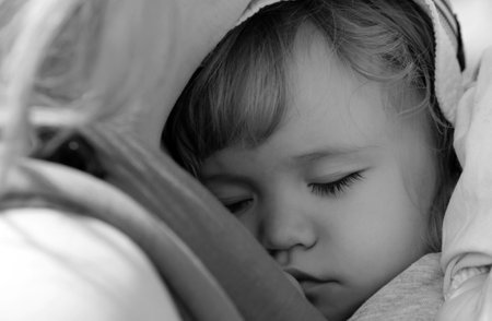 Baby sleeping in the bed. Kids sleepy face, child sleep. Closeup face.の写真素材