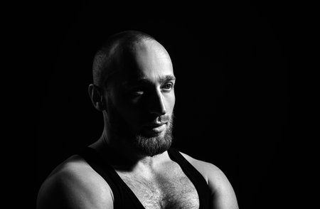 Young handsome man with red beard, mustache and trendy hairdo.の写真素材