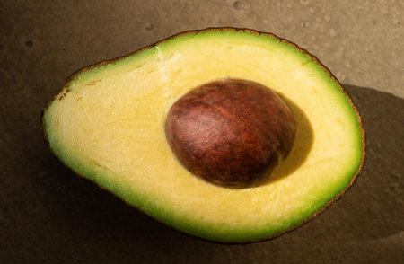 Avocado with a half, macro close up.の写真素材