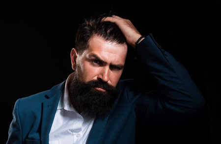 Man haircut, modern hair style. Portrait of male model with long hair. Healthcare and hair care concept.の写真素材