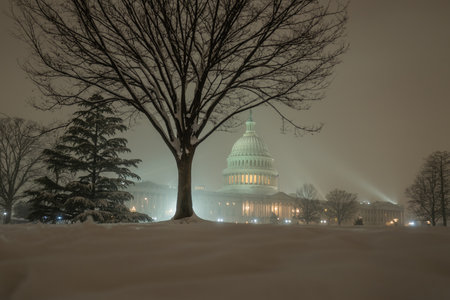 Snowfall in DC. Winter in American Capitol Washington D.C. Capitol building at night evening winter. U.S. Capitol in snow historical photos. Winter Capitol Hill in Washington D.C.の写真素材